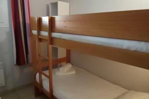 En eller flere senge i et værelse på Apartment for 6 - Residence Pierre & Vacances