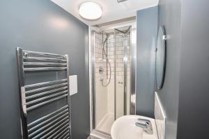 a bathroom with a shower and a toilet and a sink at 4 Private Rooms in Shared Apartment with Kitchen in Leeds