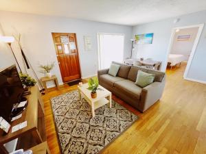 a living room with a couch and a table at Great Escape Apartments By Lowkl in Fort Lauderdale +44 photos
