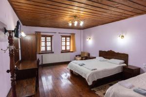 Ένα ή περισσότερα κρεβάτια σε δωμάτιο στο Ξενοδοχείο Μάνης