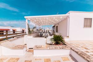 a view from the roof of a house with a patio at LORY'S HOUSE in Porto Cesareo