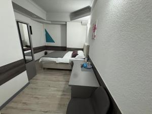 a small room with a bed and a desk in it at Banja Luka Arcadia in Banja Luka +12 photos