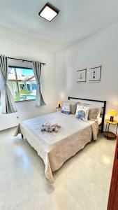 En eller flere senge i et værelse på Alto Loft Geribá + 48 billeder