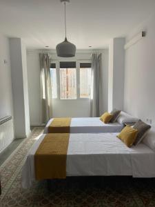 Postel nebo postele na pokoji v ubytování El mirador de la Puerta Talavera