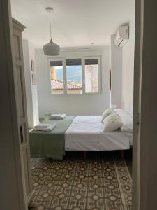 Postel nebo postele na pokoji v ubytování El mirador de la Puerta Talavera