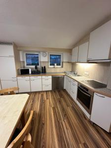 Kuchyň nebo kuchyňský kout v ubytování Apart Neunerhof