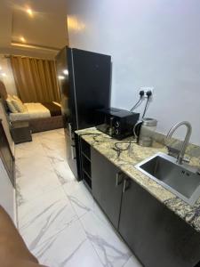 Kuchyň nebo kuchyňský kout v ubytování Juliet's Place Residence & Hotels