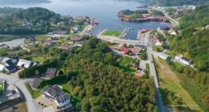 an aerial view of a small town next to a lake at Sørlandets paradis in Svenevik