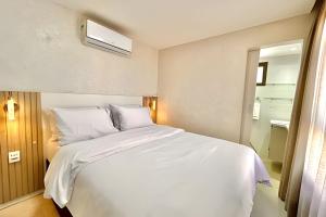 En eller flere senge i et værelse på VISTA MAR Encantadora Conforto e Estilo