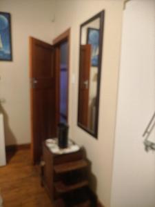 a room with a stair case and a mirror on a wall at Brando bnb in King Williamʼs Town +29 photos