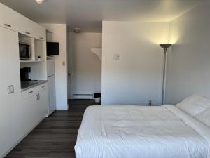 Postel nebo postele na pokoji v ubytování Hébergements ASLC Baie-Comeau