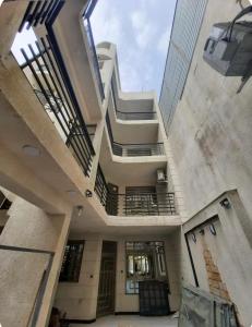 an empty building with a staircase in a building at Jadriya Serviced Residences in Baghdad