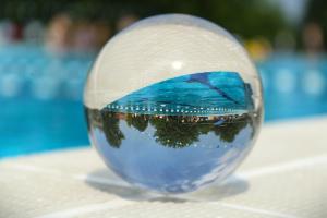 a glass ball with a picture of the ocean at Panna Ház in Jászapáti