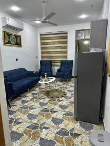 a living room with a couch and a table at Jadriya Serviced Residences in Baghdad