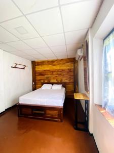 a bedroom with a bed in a room at Villa Meleno in Weligama