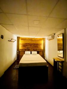a bedroom with a large bed in a room at Villa Meleno in Weligama
