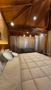 En eller flere senge i et værelse på Hotel Fazenda Igarapés