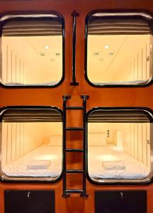 a group of bunk beds in a train at Factor Inn - Old Quarter Centre in Hanoi
