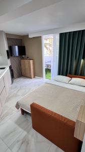 a bedroom with a large bed and a large window at Las Americas 200A apartment in Costa de Adeje