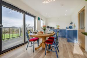 a kitchen and dining room with a table and chairs at 2 Bed in Crackington Haven oc-h33817 in Crackington Haven
