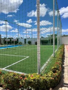 Tennis- og/eller squashfaciliteter på Apartamento térreo em condomínio 24 hrs eller i nærheden