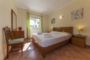 En eller flere senge i et værelse på D07 - Torraltinha Villa in Lagos