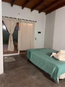 En eller flere senge i et værelse på Quinta Los Barrera