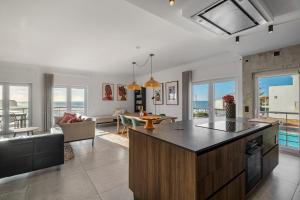 a kitchen and living room with a view of the ocean at FozPanoramic in Foz do Arelho
