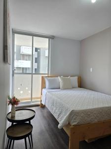 Postel nebo postele na pokoji v ubytování Más de 30 Apartamentos Privados en el Quindío con PISCINA