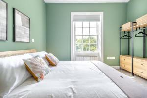 a bedroom with green walls and a large bed at 3 Bed in Cyfronydd oc-e32742 in Llanfair Caereinion