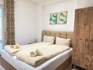 Giường trong phòng chung tại Center Apartments The Quiet Luxury 1