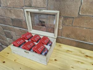 a box of coca colaarettes sitting on a table next to a wall at Nest & Rest Studio in Chişinău