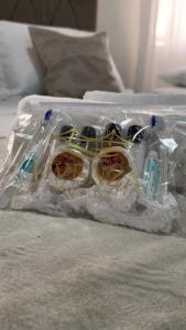 a plastic bag on a bed with electrical equipment at Pousada Vivenza in Laguna