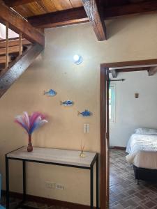 En eller flere senge i et værelse på Melongos Jardín