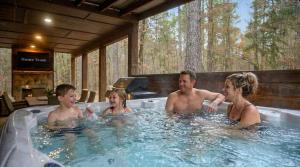 a group of people in a bath tub at Amazing Views Hot Tub Fire Pit Dog Friendly in Stephens Gap