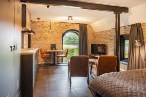 TV/trung tâm giải trí tại De Kasteelboerderij