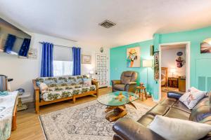 a living room with a couch and a table at Pet-Friendly Bradenton Home 1.5 Mi to Cortez Beach in Bradenton
