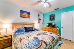 a bedroom with a bed and a desk and a television at Pet-Friendly Bradenton Home 1.5 Mi to Cortez Beach in Bradenton