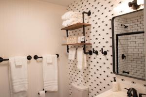 a bathroom with a sink and a mirror and towels at The Boha Hotel in Lake Placid +29 photos