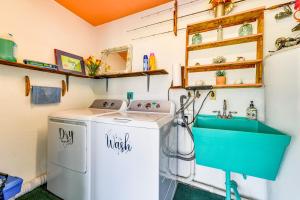 a bathroom with a washing machine and a sink at Pet-Friendly Bradenton Home 1.5 Mi to Cortez Beach in Bradenton +18 photos