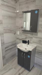 a bathroom with a sink and a mirror at Villa Nova Ohrid in Ohrid +23 photos