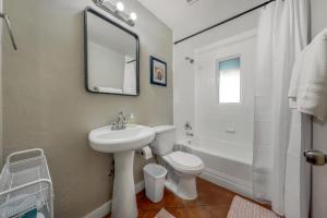 a bathroom with a sink and a toilet and a mirror at Santa Rita Primary (Mike Morgan) in Tucson +21 photos