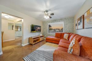 a living room with a couch and a tv at Santa Rita Primary (Mike Morgan) in Tucson
