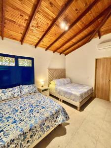 En eller flere senge i et værelse på Casa acogedora