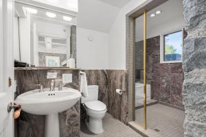 a bathroom with a sink and a toilet and a shower at Sonoma Stonehouse Hotel in Santa Rosa +98 photos