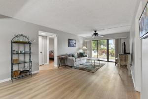 a living room with a couch and a table at IMG Condo Near Golf Course in Bradenton