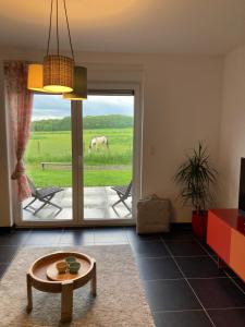 Posezení v ubytování La petite maison dans la prairie