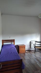 En eller flere senge i et værelse på Los Caniches Concepcion del uruguay