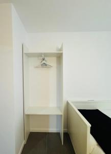 a room with a white wall and a shelf at El Sueño De Albarracín IV in Albarracín +6 photos