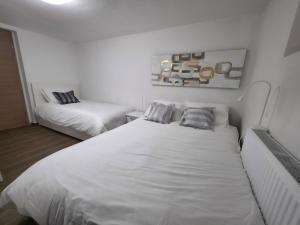 Postel nebo postele na pokoji v ubytování Guesthouse Flower